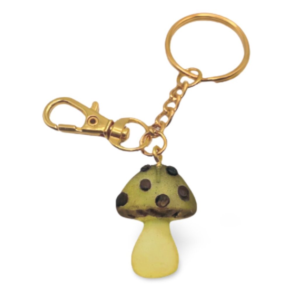 Small yellowish orange mushroom with black accents keychain